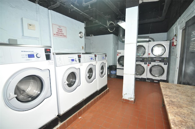 39-60 52nd St Unit 4F, Woodside, NY 11377 - community laundry room with washer and dryer, estacked washer and dryer, and tile patterned flooring
