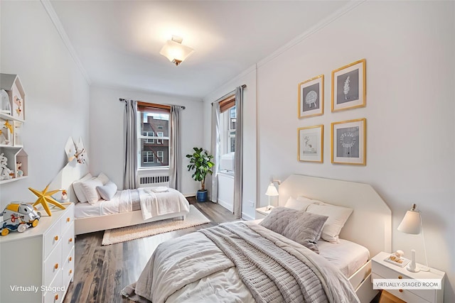 39-60 52nd St Unit 4F, Woodside, NY 11377 - bedroom with wood finished floors, crown molding, and radiator heating unit