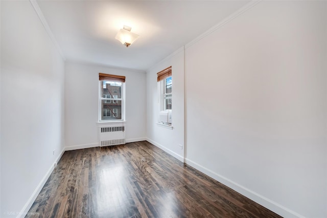 39-60 52nd St Unit 4F, Woodside, NY 11377 - spare room with radiator heating unit, dark wood finished floors, and crown molding