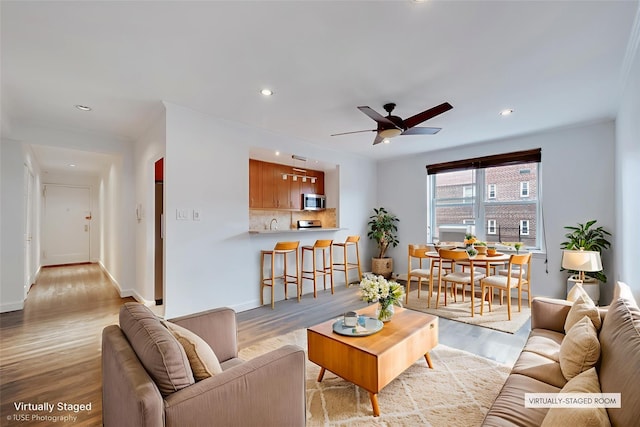 39-60 52nd St Unit 4F, Woodside, NY 11377 - living area featuring wood finished floors, ceiling fan, and recessed lighting