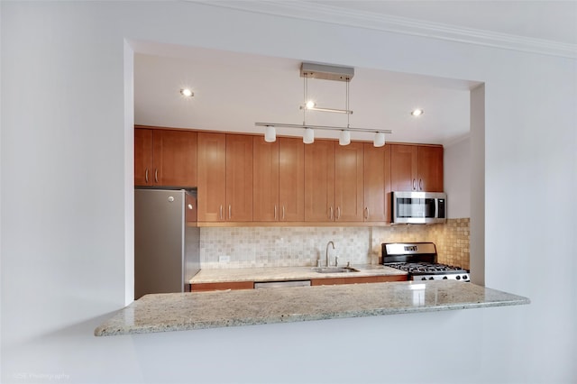 39-60 52nd St Unit 4F, Woodside, NY 11377 - kitchen with appliances with stainless steel finishes, tasteful backsplash, light stone counters, ornamental molding, and brown cabinets