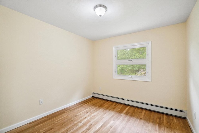 542 Montauk Hwy, Southampton, NY 11968 - spare room with a baseboard radiator and light wood-type flooring