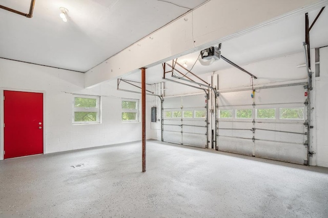 542 Montauk Hwy, Southampton, NY 11968 - garage with a garage door opener, electric panel, and concrete block wall