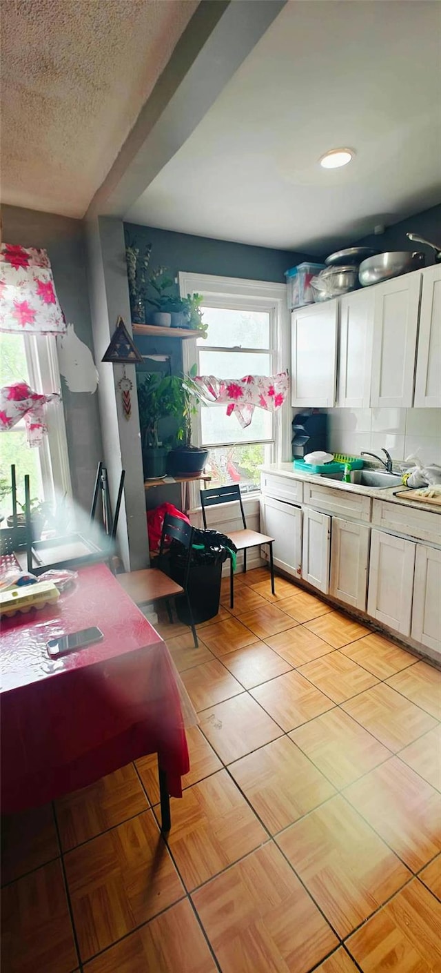 10439 42nd Ave, Corona, NY 11368 - kitchen featuring light countertops and light tile patterned flooring