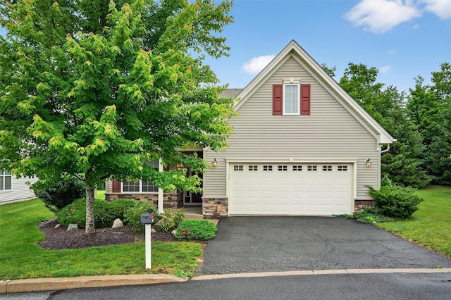 84 Jasmine Dr, Middletown, NY 10940 - view of front facade with asphalt driveway, an attached garage, and a front yard