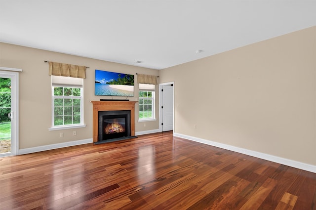 84 Jasmine Dr, Middletown, NY 10940 - unfurnished living room featuring wood finished floors and a glass covered fireplace