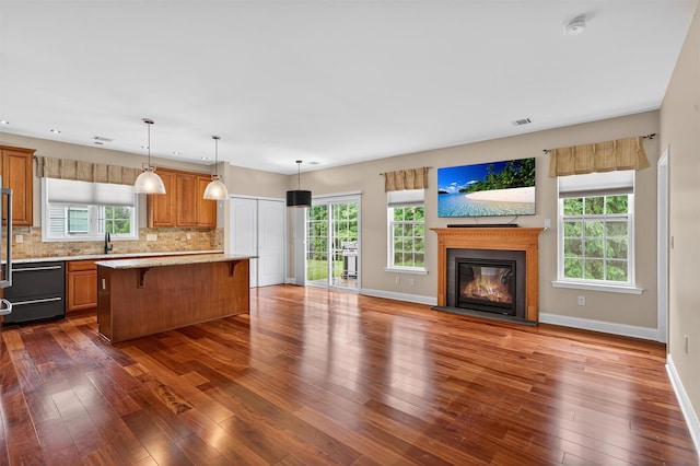 84 Jasmine Dr, Middletown, NY 10940 - kitchen featuring a kitchen breakfast bar, dishwasher, open floor plan, and dark wood-type flooring