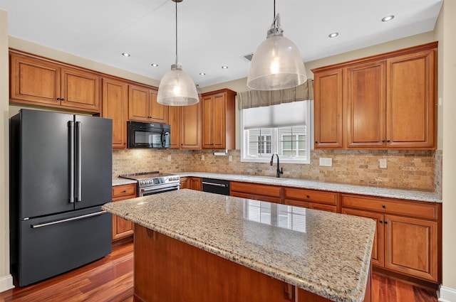 84 Jasmine Dr, Middletown, NY 10940 - kitchen featuring black appliances, dark wood-style flooring, brown cabinets, and recessed lighting
