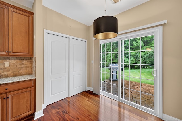 84 Jasmine Dr, Middletown, NY 10940 - unfurnished dining area featuring dark wood-style flooring and baseboards