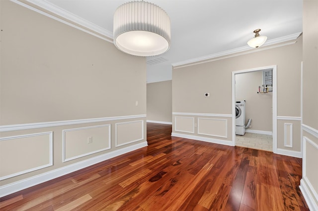 84 Jasmine Dr, Middletown, NY 10940 - unfurnished room with wood finished floors, crown molding, washer / dryer, a decorative wall, and a wainscoted wall