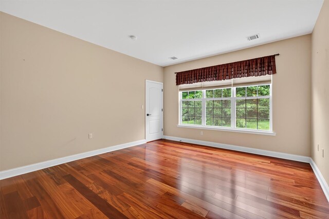 84 Jasmine Dr, Middletown, NY 10940 - spare room with wood finished floors and a smoke detector
