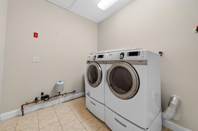 84 Jasmine Dr, Middletown, NY 10940 - laundry room featuring washing machine and dryer and light tile patterned flooring