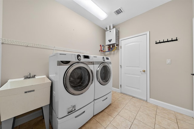 84 Jasmine Dr, Middletown, NY 10940 - washroom with separate washer and dryer and light tile patterned flooring