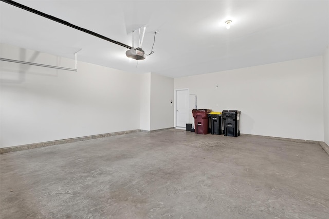 84 Jasmine Dr, Middletown, NY 10940 - garage featuring a garage door opener and baseboards