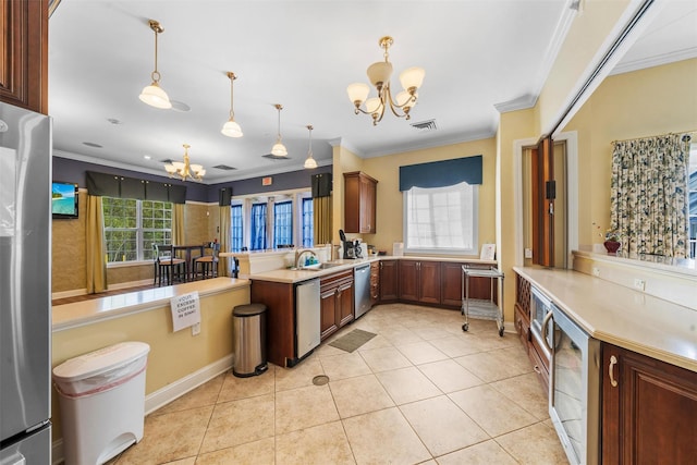 84 Jasmine Dr, Middletown, NY 10940 - kitchen with a chandelier, ornamental molding, stainless steel appliances, wine cooler, and light countertops