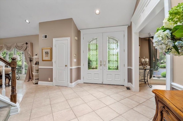 6 Laurelwood Ct, Dix Hills, NY 11746 - entryway featuring french doors, stairs, light tile patterned floors, vaulted ceiling, and recessed lighting