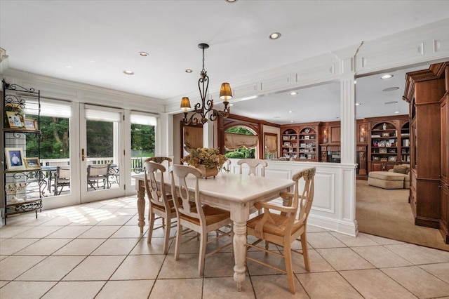 6 Laurelwood Ct, Dix Hills, NY 11746 - dining room featuring light tile patterned floors, french doors, recessed lighting, built in shelves, and light colored carpet