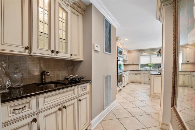 6 Laurelwood Ct, Dix Hills, NY 11746 - kitchen with cream cabinetry, tasteful backsplash, light tile patterned floors, stainless steel double oven, and dark stone counters