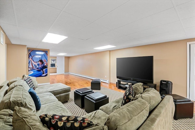 6 Laurelwood Ct, Dix Hills, NY 11746 - living room featuring a baseboard heating unit, a paneled ceiling, and wood finished floors