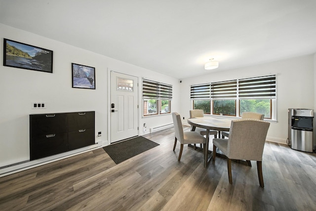 2 Woodland Way N, Ellenville, NY 12428 - dining room featuring plenty of natural light, wood finished floors, and baseboard heating