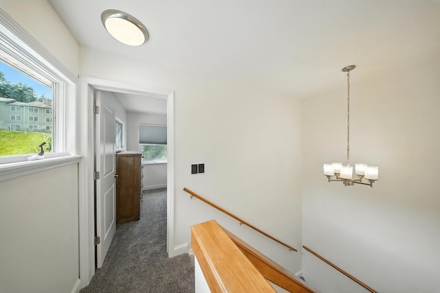 2 Woodland Way N, Ellenville, NY 12428 - hallway with an upstairs landing, a chandelier, and carpet flooring
