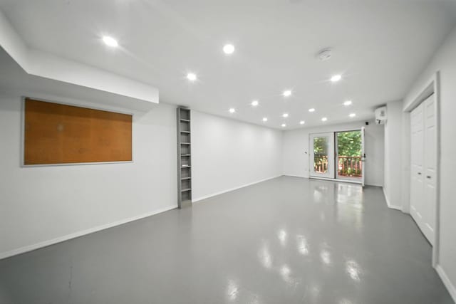 2 Woodland Way N, Ellenville, NY 12428 - unfurnished living room with recessed lighting, finished concrete floors, and built in shelves