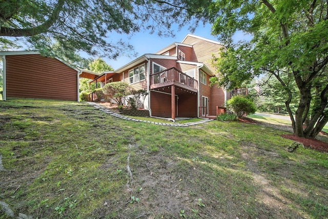 2 Woodland Way N, Ellenville, NY 12428 - rear view of house with a deck and a lawn