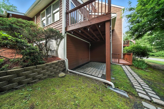 2 Woodland Way N, Ellenville, NY 12428 - view of side of home featuring a wooden deck and a patio