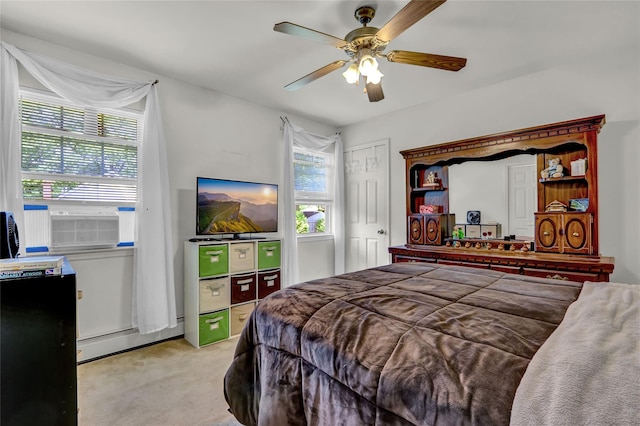 178 Magnolia Dr, Mastic Beach, NY 11951 - bedroom featuring light carpet, baseboard heating, and a ceiling fan