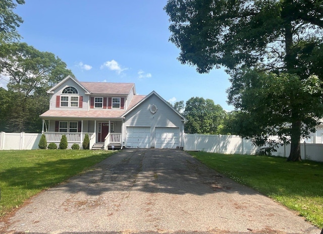 85 Patchogue Ave, Mastic, NY 11950 - colonial house featuring a porch, a garage, and asphalt driveway