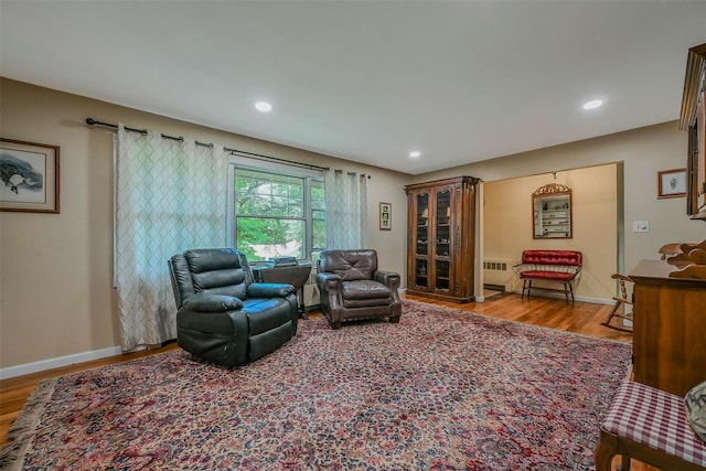 18 Huyler Ct, Setauket, NY 11733 - living area with wood finished floors, radiator heating unit, and recessed lighting