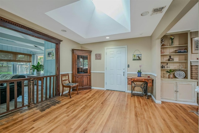 18 Huyler Ct, Setauket, NY 11733 - entrance foyer with light wood-style floors, recessed lighting, and a skylight