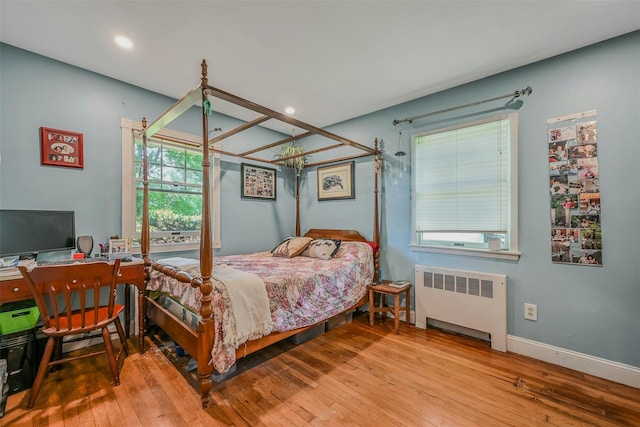 18 Huyler Ct, Setauket, NY 11733 - bedroom with radiator heating unit, hardwood / wood-style floors, and recessed lighting