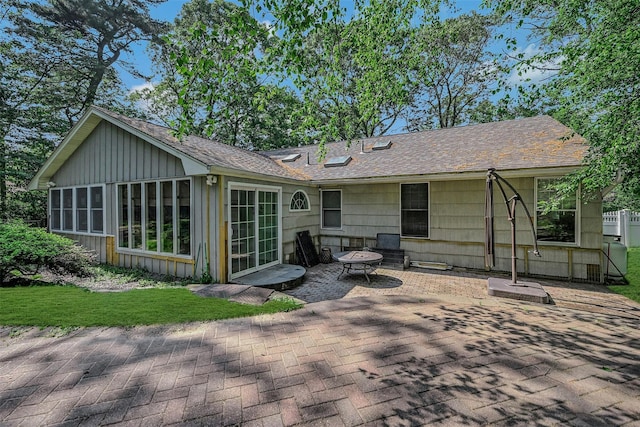18 Huyler Ct, Setauket, NY 11733 - back of house with a patio, board and batten siding, and a shingled roof