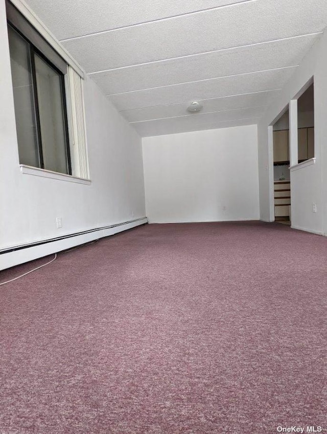 136-24 Maple Ave Unit 3B, Flushing, NY 11355 - unfurnished room featuring carpet floors, baseboard heating, and a smoke detector