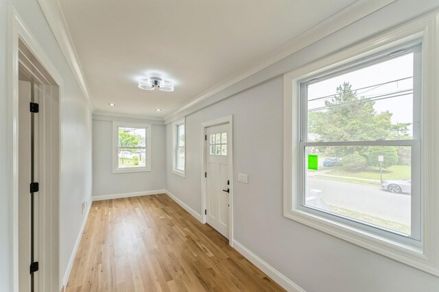 237 Linden Ave, Westbury, NY 11590 - foyer entrance with light wood-style flooring and crown molding