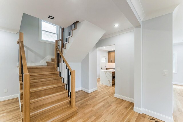 237 Linden Ave, Westbury, NY 11590 - staircase featuring wood finished floors, recessed lighting, and ornamental molding