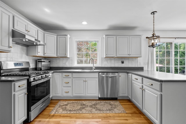 38 Southview Ct, Poughkeepsie, NY 12603 - kitchen with appliances with stainless steel finishes, under cabinet range hood, a peninsula, plenty of natural light, and recessed lighting