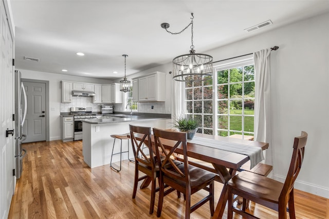 38 Southview Ct, Poughkeepsie, NY 12603 - dining room with a chandelier, light wood-type flooring, and recessed lighting