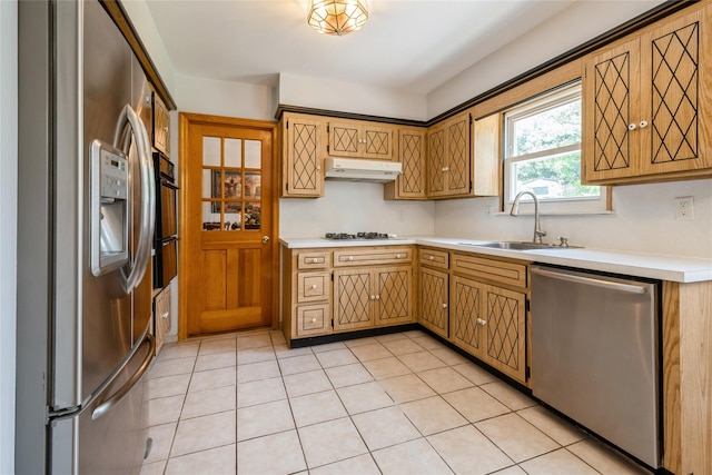 51 Lester Dr, Orangeburg, NY 10962 - kitchen with appliances with stainless steel finishes, under cabinet range hood, light countertops, and light tile patterned floors