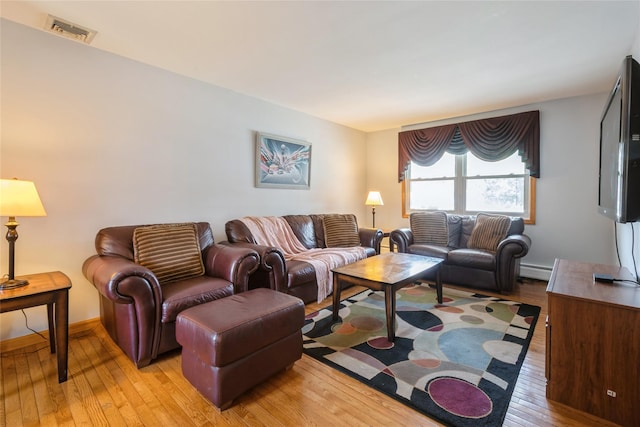 51 Lester Dr, Orangeburg, NY 10962 - living area featuring light wood-style floors and baseboard heating