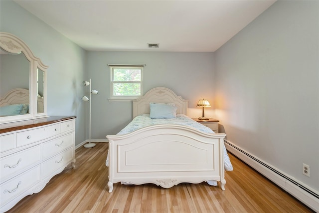 51 Lester Dr, Orangeburg, NY 10962 - bedroom featuring a baseboard radiator and light wood finished floors