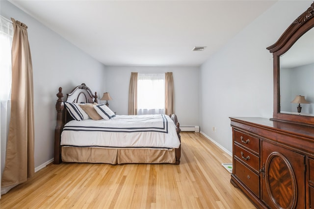 51 Lester Dr, Orangeburg, NY 10962 - bedroom with light wood-style flooring and baseboard heating