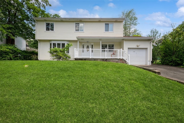 51 Lester Dr, Orangeburg, NY 10962 - view of front facade featuring a porch, an attached garage, a front lawn, and asphalt driveway