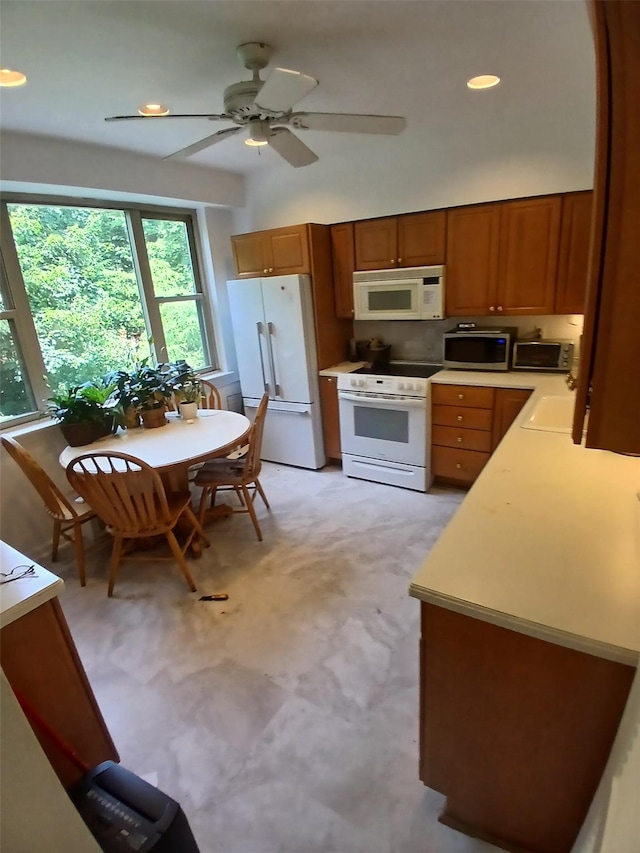 72 Pondfield Rd W Unit 2F, Bronxville, NY 10708 - kitchen featuring white appliances, brown cabinets, light countertops, a ceiling fan, and recessed lighting
