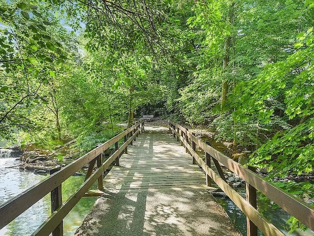72 Pondfield Rd W Unit 2F, Bronxville, NY 10708 - surrounding community featuring a water view and a forest view