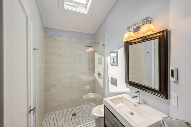 35 Library Ave Unit 8X, Westhampton Beach, NY 11978 - full bathroom featuring tiled shower, vanity, a skylight, and vaulted ceiling