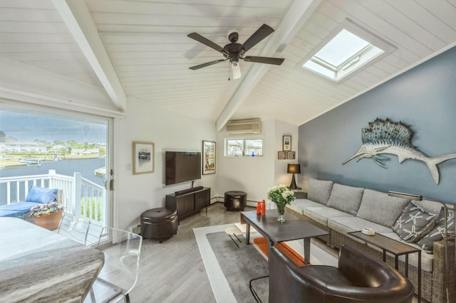 35 Library Ave Unit 8X, Westhampton Beach, NY 11978 - living area with a skylight, a wall mounted air conditioner, wood finished floors, and a ceiling fan