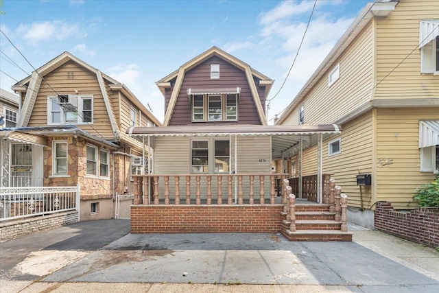 4216 Wickham Ave, Bronx, NY 10466 - colonial inspired home featuring a porch and a gambrel roof