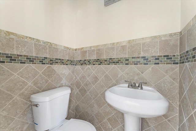 4216 Wickham Ave, Bronx, NY 10466 - bathroom featuring toilet and tile walls
